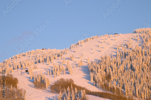 sunset on ski slopes at winter