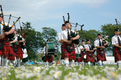 scottish band marching on grass