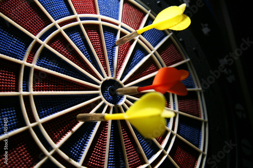 dart boart with three darts