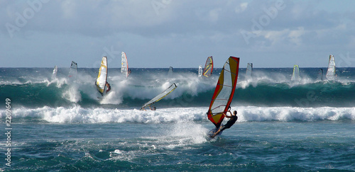 People windsurfing on high waves