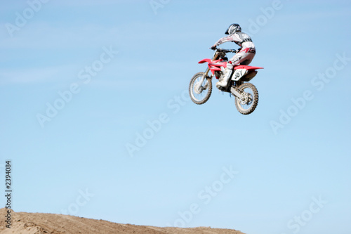 motorcycle jumping high in the air