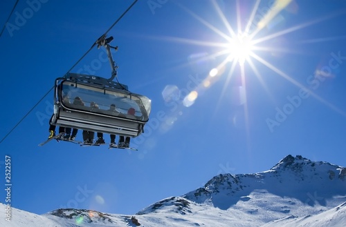 skiers in a chairlift