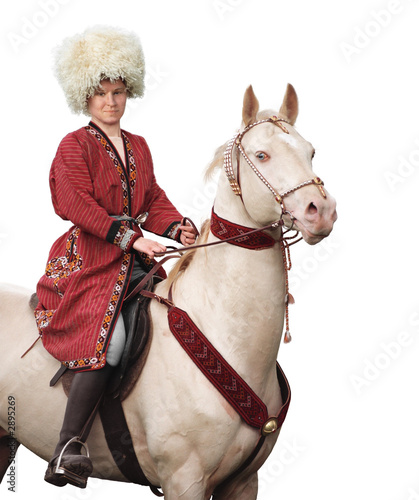 rider and akhal-teke horse - isolated on white
