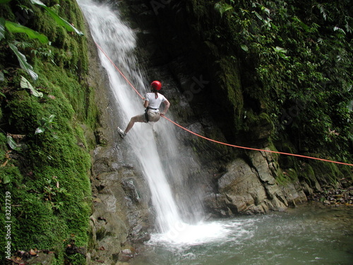 woman rappelling falls