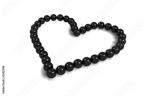 collier coeur perles noires sur fond blanc