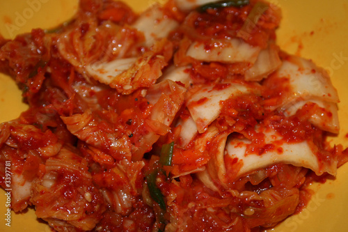 spicy kimchi in yellow bowl