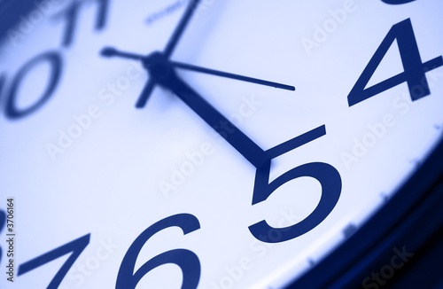 Five o clock - detail of wall office clock 