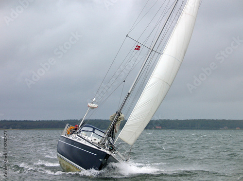 Sailboat racing in the winter in strong winds and rough sea