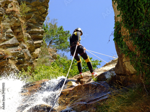 Woman descending on rappel