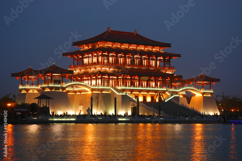 Tang building at night with reflection