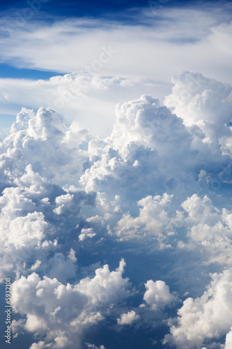 A dramatic cloudscape background with cumulus clouds