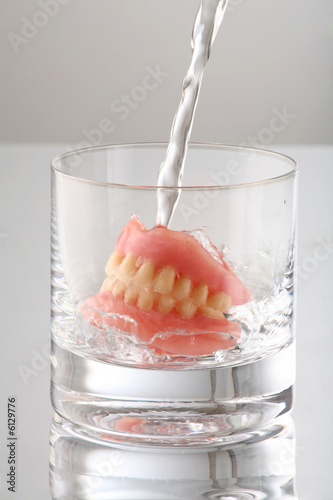 artificial Teeth on glass with water