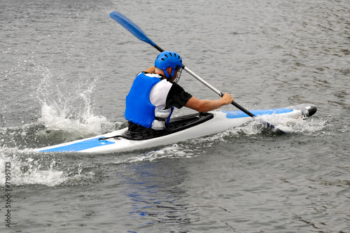 Man racing in kayak