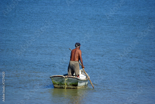 lonely fisherman going for boat trip