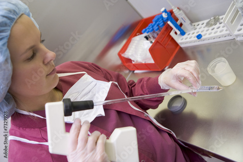 Embryologist processing sample