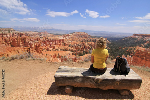 Girl sitting and looking at landscape