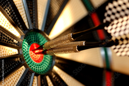 Three arrows in the centre of a dart board