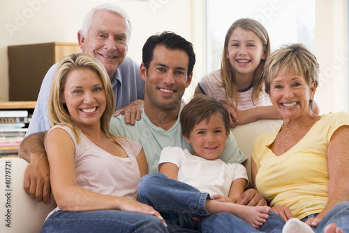 Extended family in living room smiling