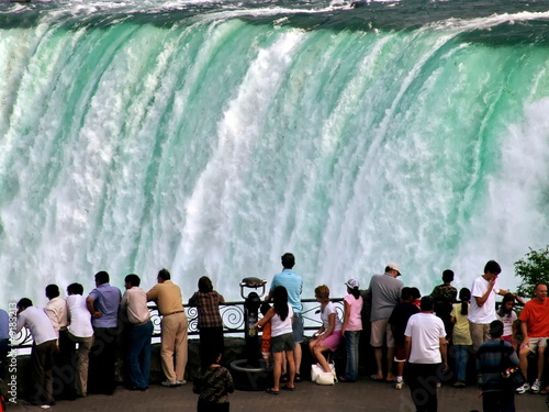 People on falling water background. Niagara Falls
