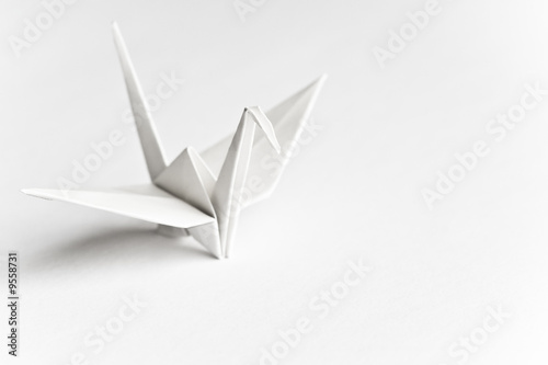 An origami bird on a white background