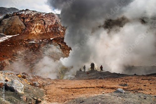 People inside active volcanic crater