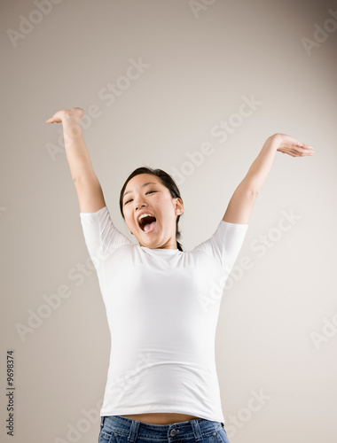 Excited woman cheering and celebrating her success