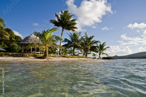 view of a paradisical little island in samoa from the water