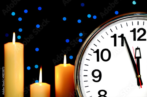 three minutes to midnight with blue lights and candles