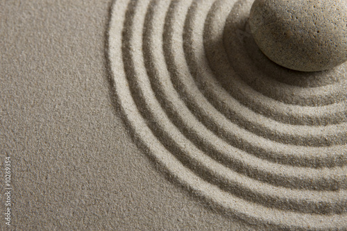 Close-up of a stone on raked sand