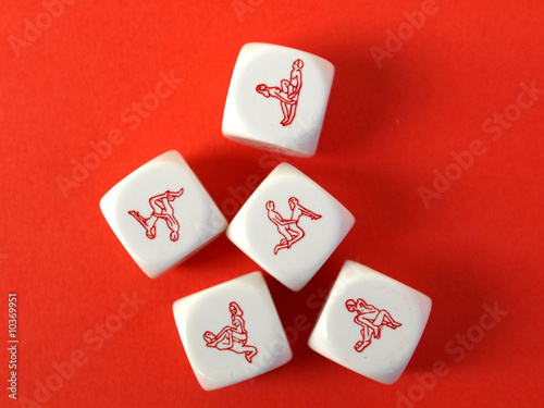 Erotic dices on red background
