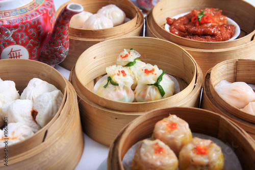 variety of dim sum in bamboo steam containers