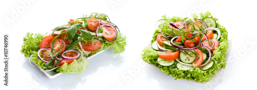 Fresh salad with onion, tomato and basil isolated
