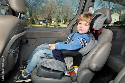 Preschool age boy in a booster seat