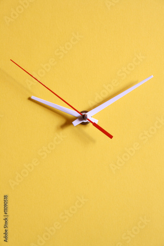 Yellow papery clock dial with moving second hand