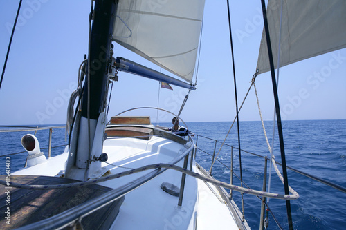 Sailing with an old sailboat over mediterranean sea
