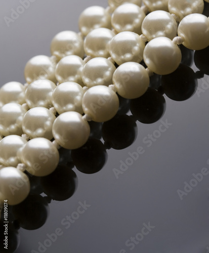 white pearls reflected on black
