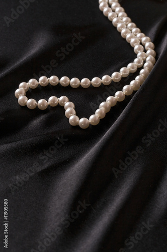 white pearls on black satin