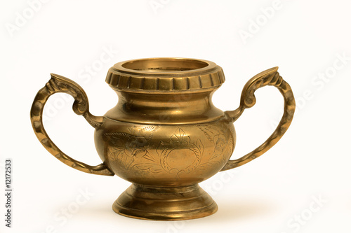 Nice ancient metal vase isolated on white background