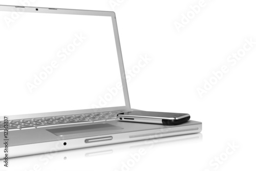 Glossy silver laptop with cellphone