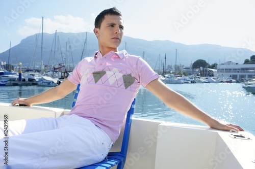 Young handsome man relaxed on a boat