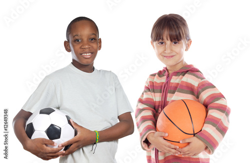 Two adorable children with balls