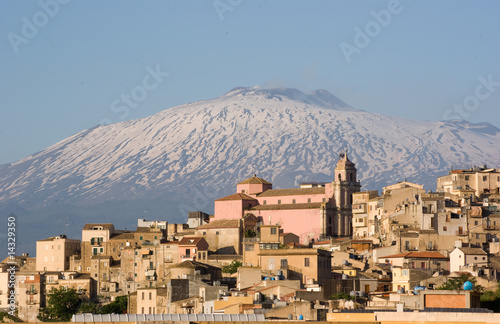 view of village and belltower on background Etna