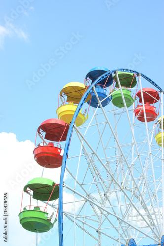 Color ferris wheel on sky background