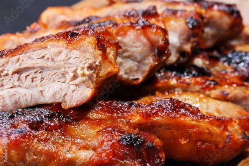 Grilled pork ribs on wooden plate