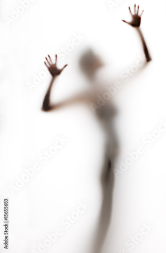 abstract, elongated, semi-obscured figure with arms raised