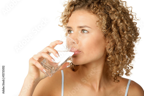 Portrait of young woman drinking water