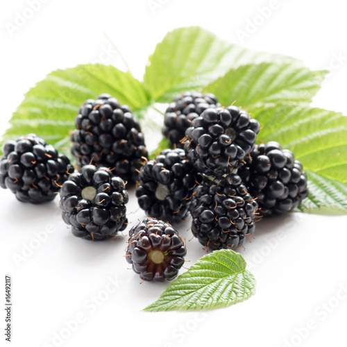 dewberries (blackberries) and green leaves.