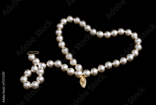 Pearls necklace on black background