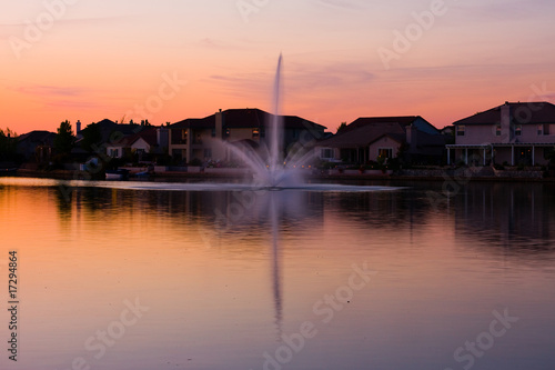 Homes by the lake at sunset