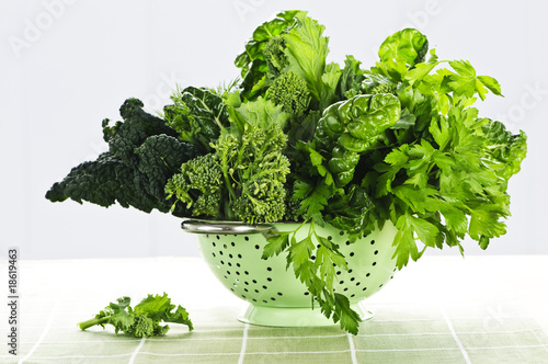 Dark green leafy vegetables in colander